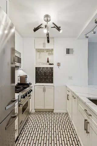 a workspace with furniture and a large window