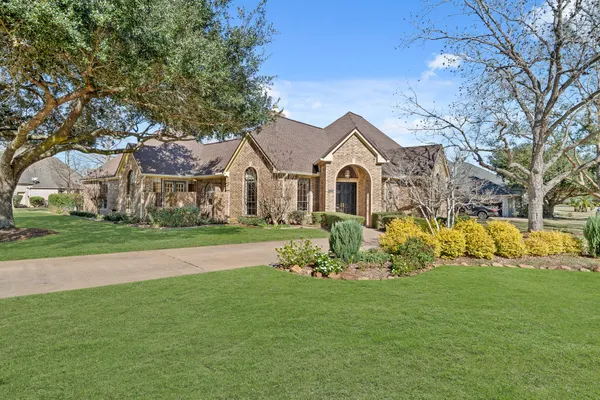 a front view of house with garden