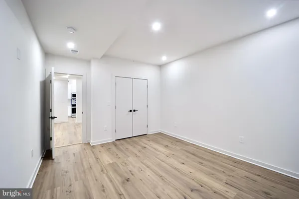 a view of room with wooden floor and window
