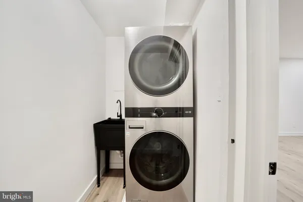 a view of entryway with stairs and white door