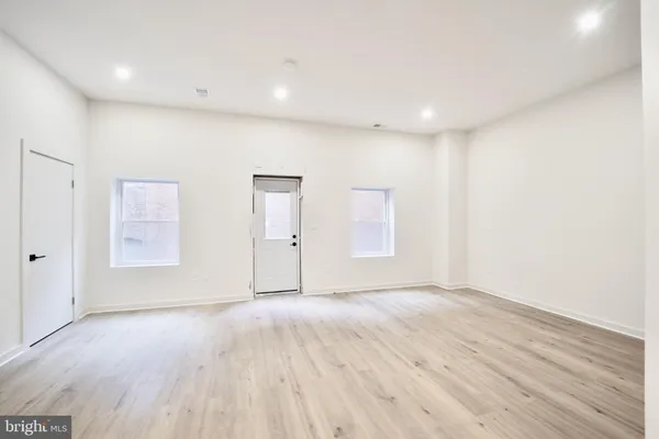 a bathroom with a double vanity sink mirror and bathtub