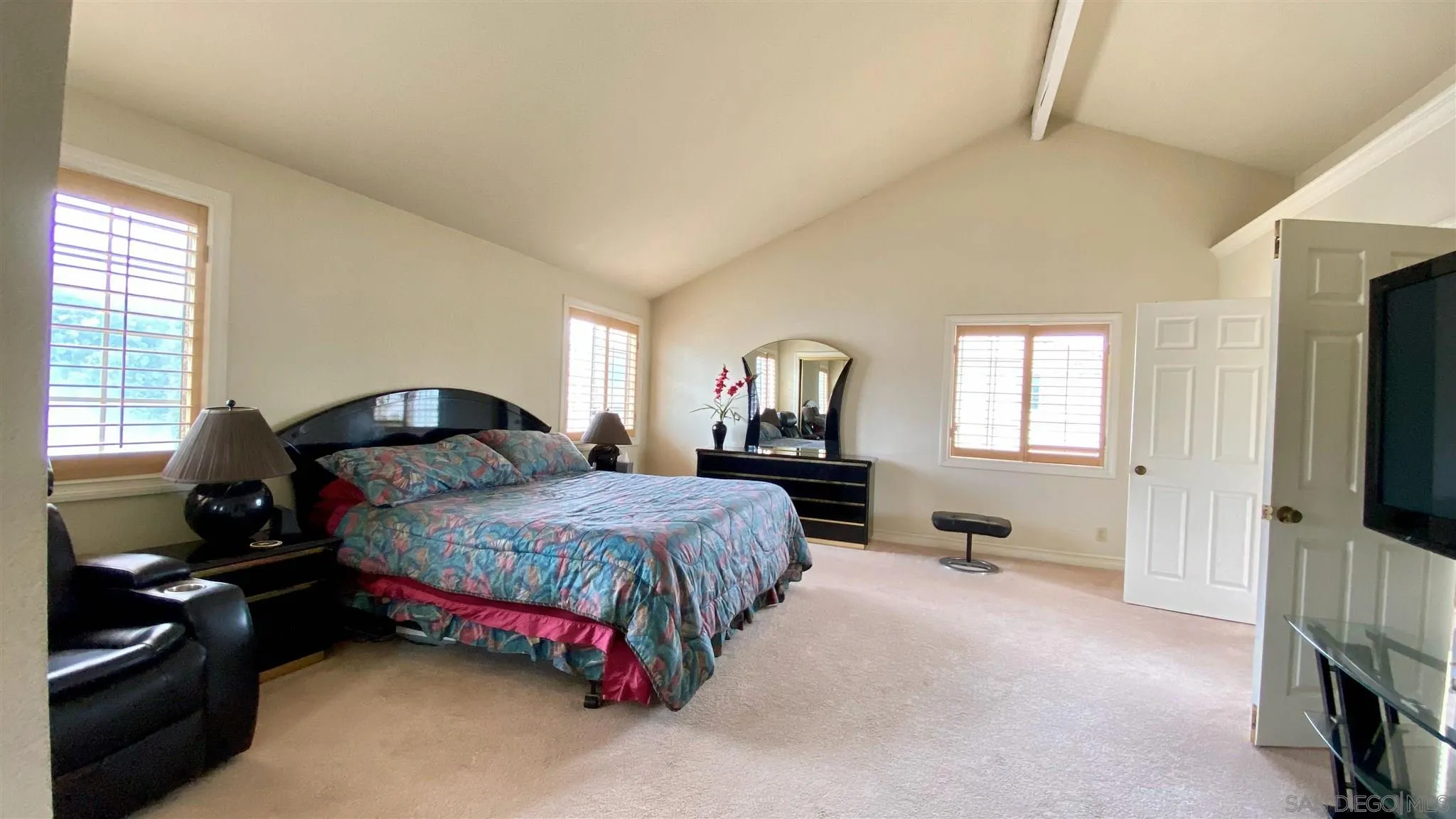 167 Marcheta Street Encinitas, CA 92024 - Photo 15 of 21 a bedroom with a bed and a tv on dresser