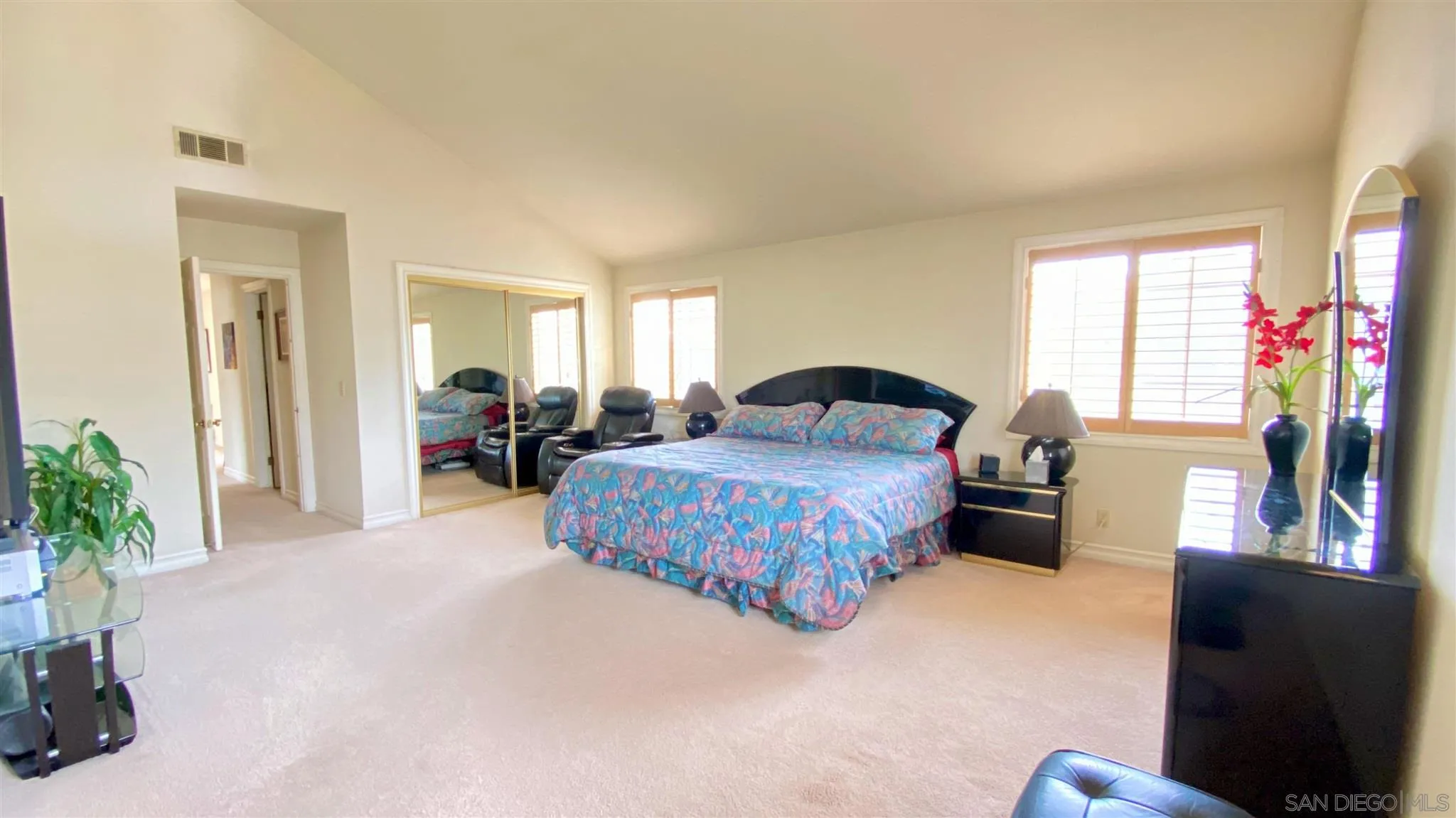 167 Marcheta Street Encinitas, CA 92024 - Photo 16 of 21 a bedroom with a bed and a potted plant