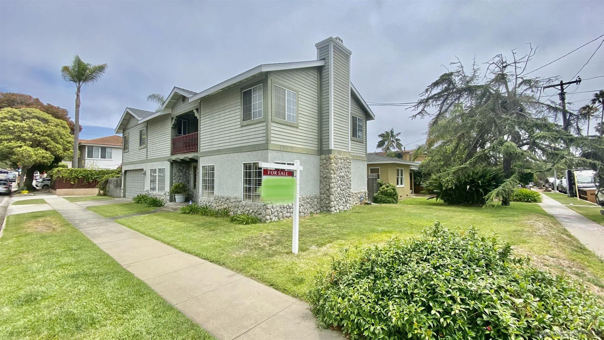 167 Marcheta Street Encinitas, CA 92024 - Photo 3 of 21 a front view of a house with a yard and garage