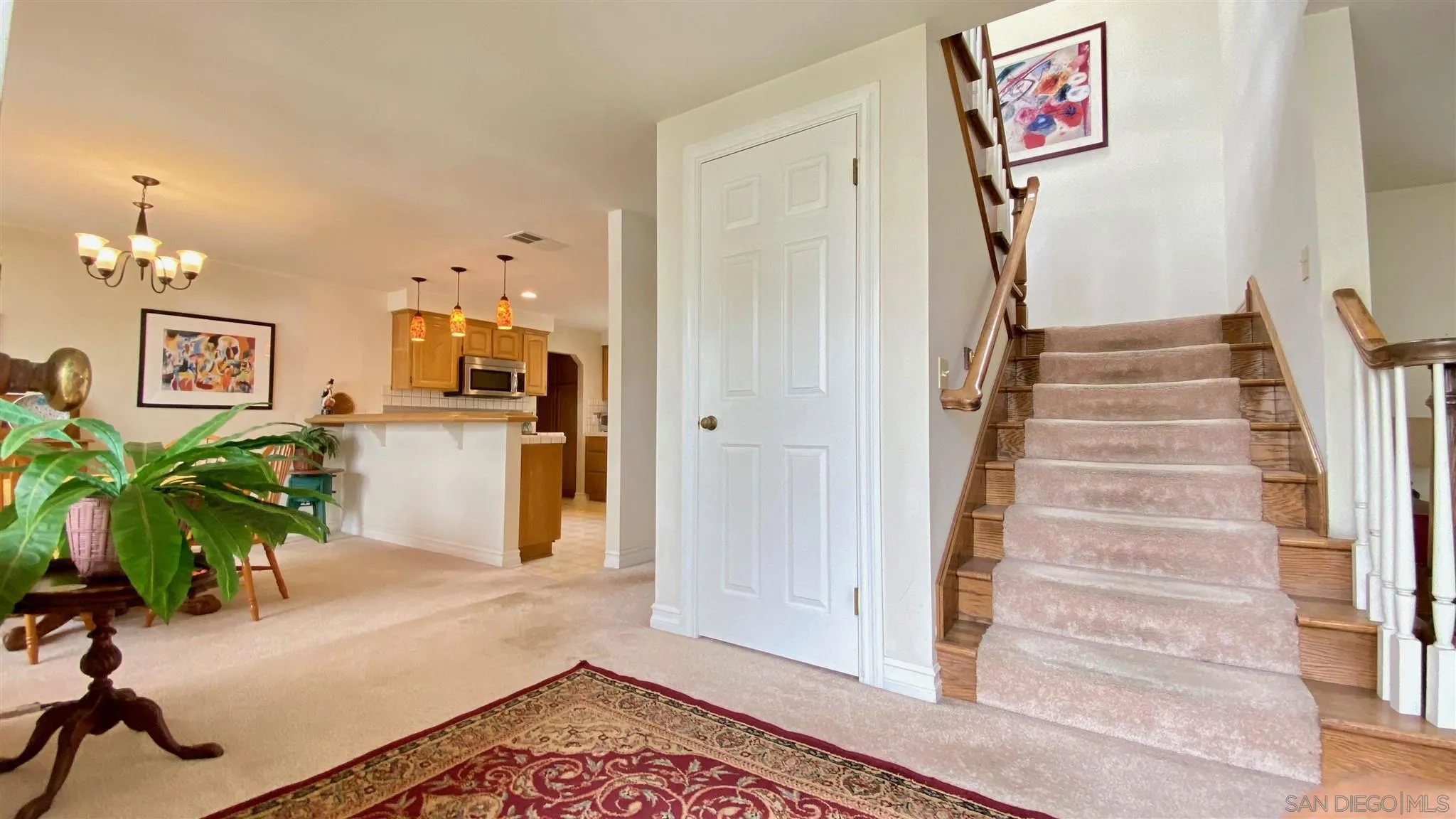 167 Marcheta Street Encinitas, CA 92024 - Photo 4 of 21 a view of a hallway with furniture and a potted plant