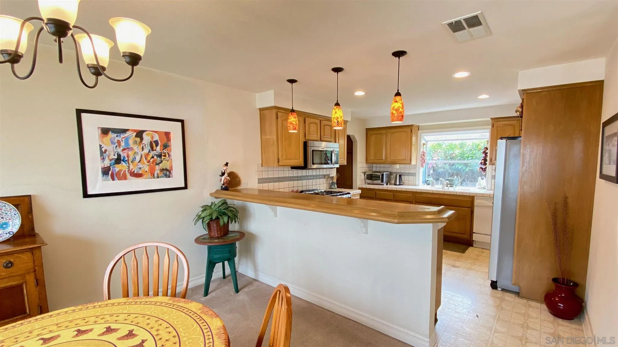 167 Marcheta Street Encinitas, CA 92024 - Photo 6 of 21 a living room with stainless steel appliances kitchen island granite countertop furniture and a large window