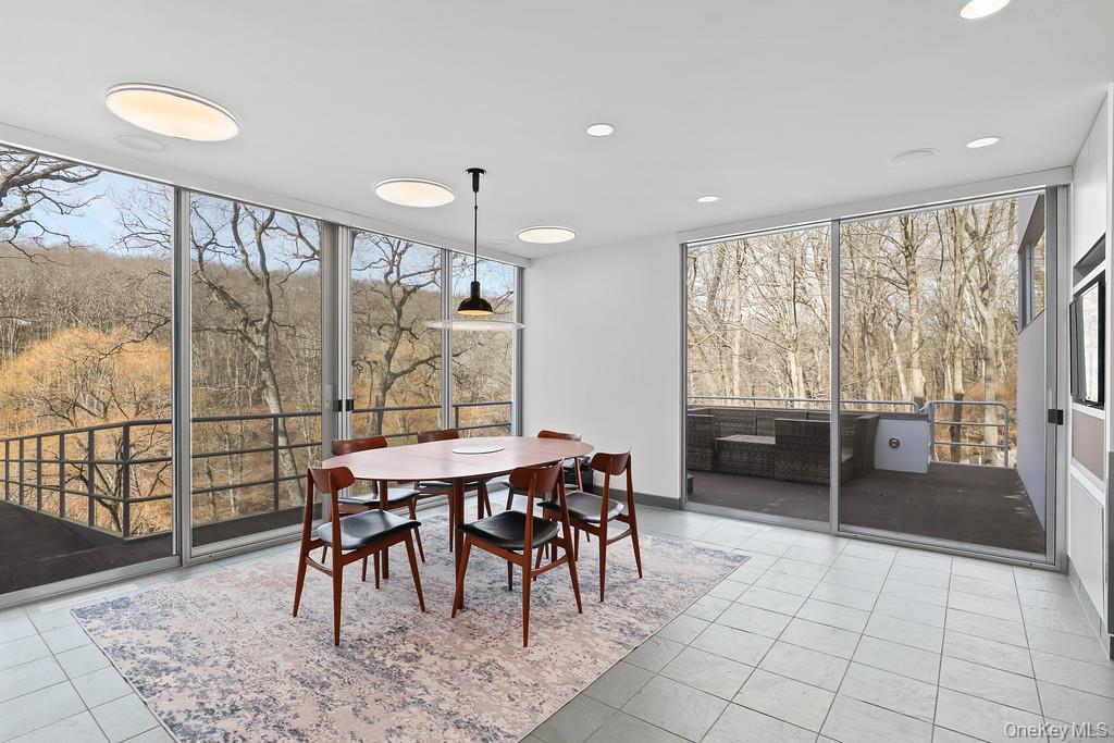 54 Cross Pond Road Pound Ridge, NY 10576 - Photo 12 of 50 a view of a dining room with furniture window and outside view