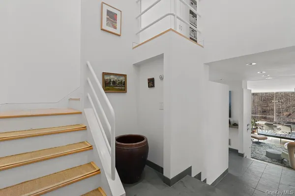 a view of entryway and kitchen