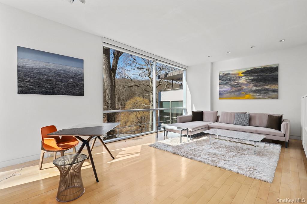 54 Cross Pond Road Pound Ridge, NY 10576 - Photo 21 of 50 a living room with furniture and a large window