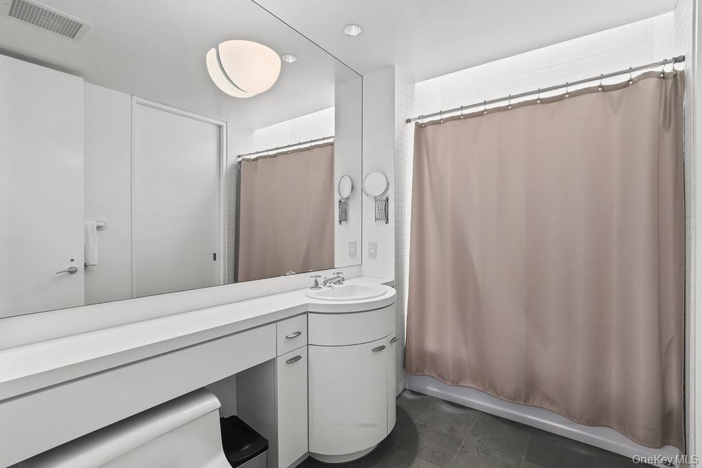 54 Cross Pond Road Pound Ridge, NY 10576 - Photo 23 of 50 a bathroom with a sink and a mirror