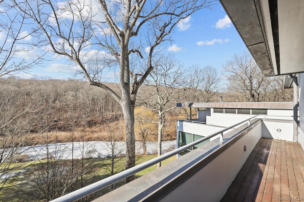 54 Cross Pond Road Pound Ridge, NY 10576 - Photo 29 of 50 a view of balcony with two large trees