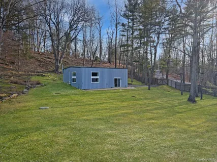a aerial view of a house with a yard