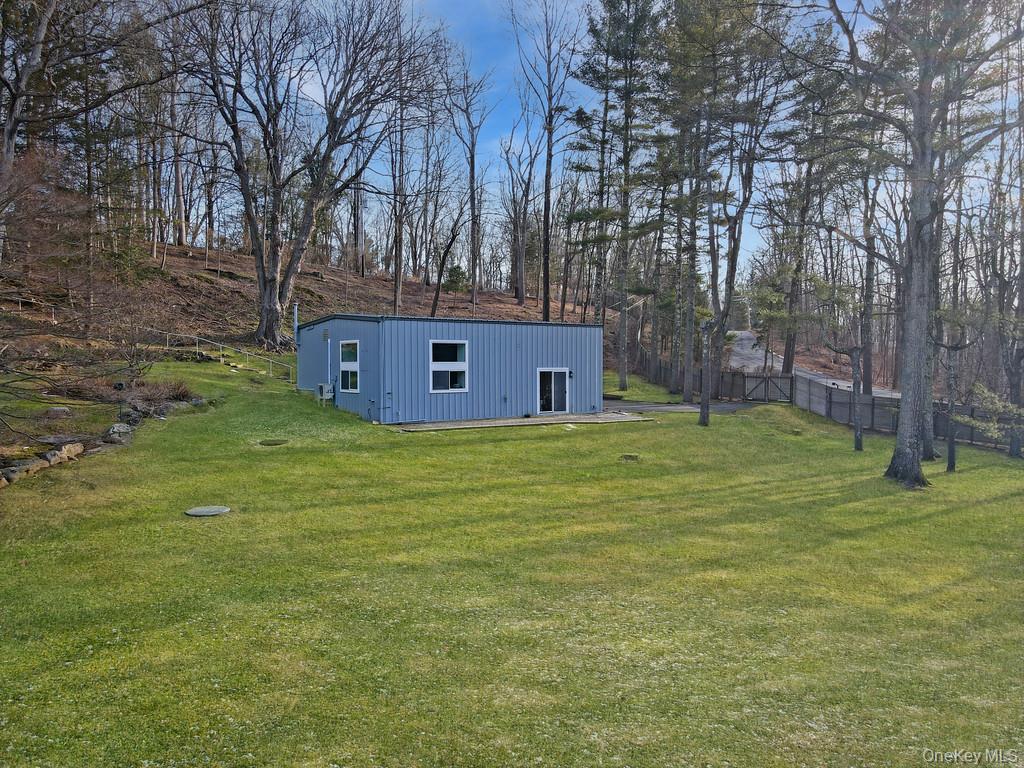 54 Cross Pond Road Pound Ridge, NY 10576 - Photo 30 of 50 a view of a house with a yard