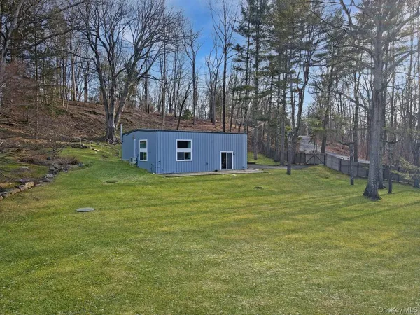 a aerial view of a house with a yard
