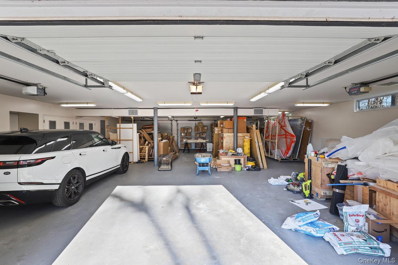 54 Cross Pond Road Pound Ridge, NY 10576 - Photo 35 of 50 a view of parking garage with cars