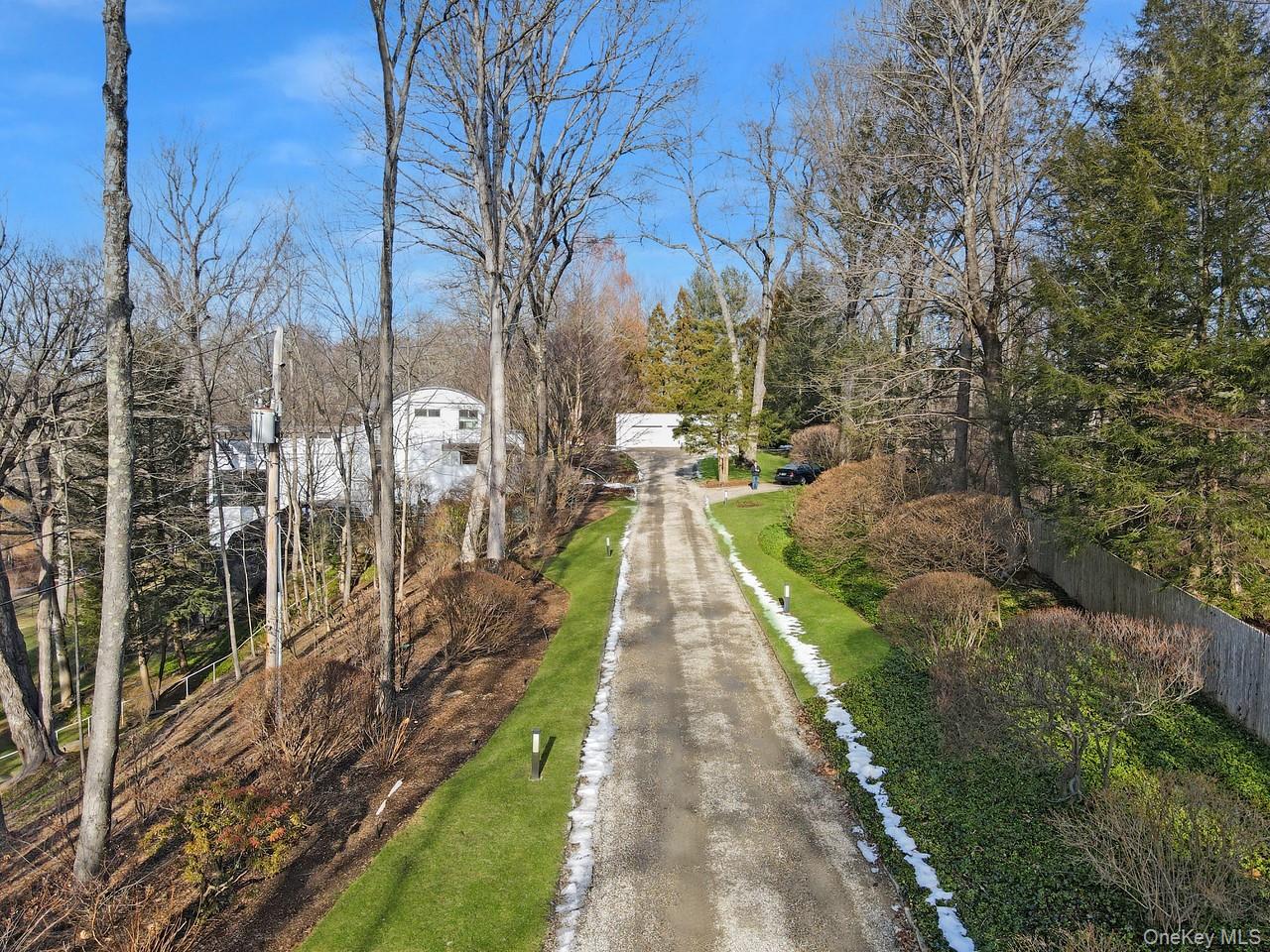 54 Cross Pond Road Pound Ridge, NY 10576 - Photo 36 of 50 a narrow alley leading to a building