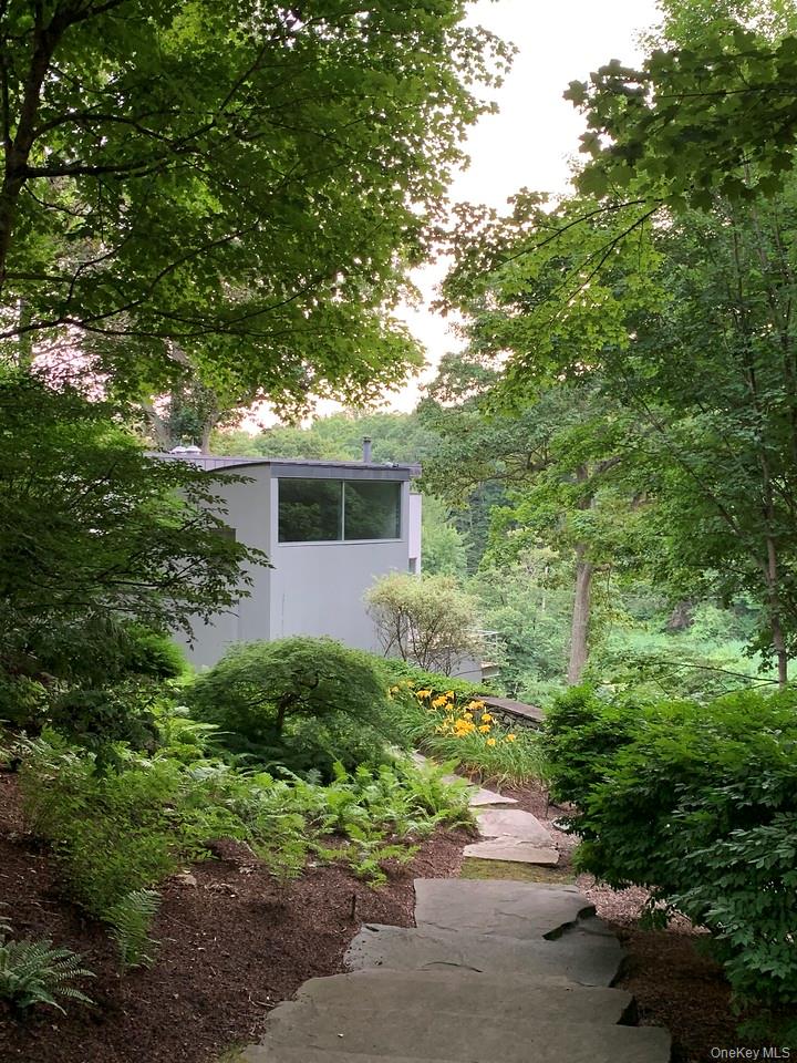 54 Cross Pond Road Pound Ridge, NY 10576 - Photo 41 of 50 a view of a house with a tree