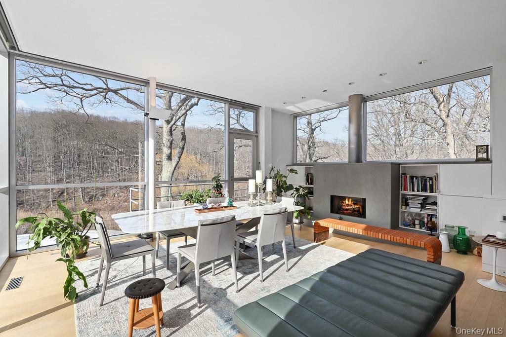 54 Cross Pond Road Pound Ridge, NY 10576 - Photo 7 of 50 a living room with furniture a large window and wooden floor