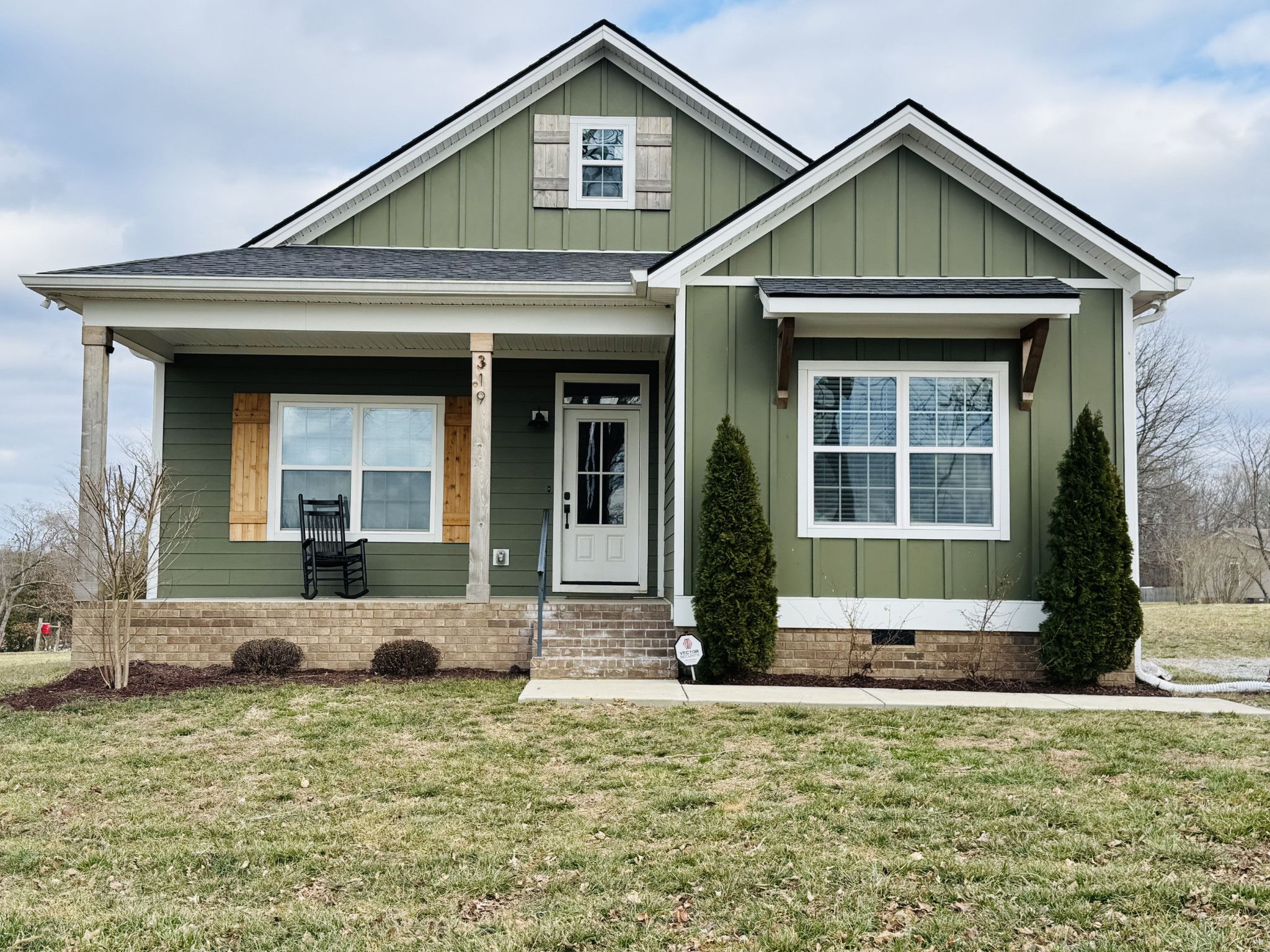 a front view of a house with garden