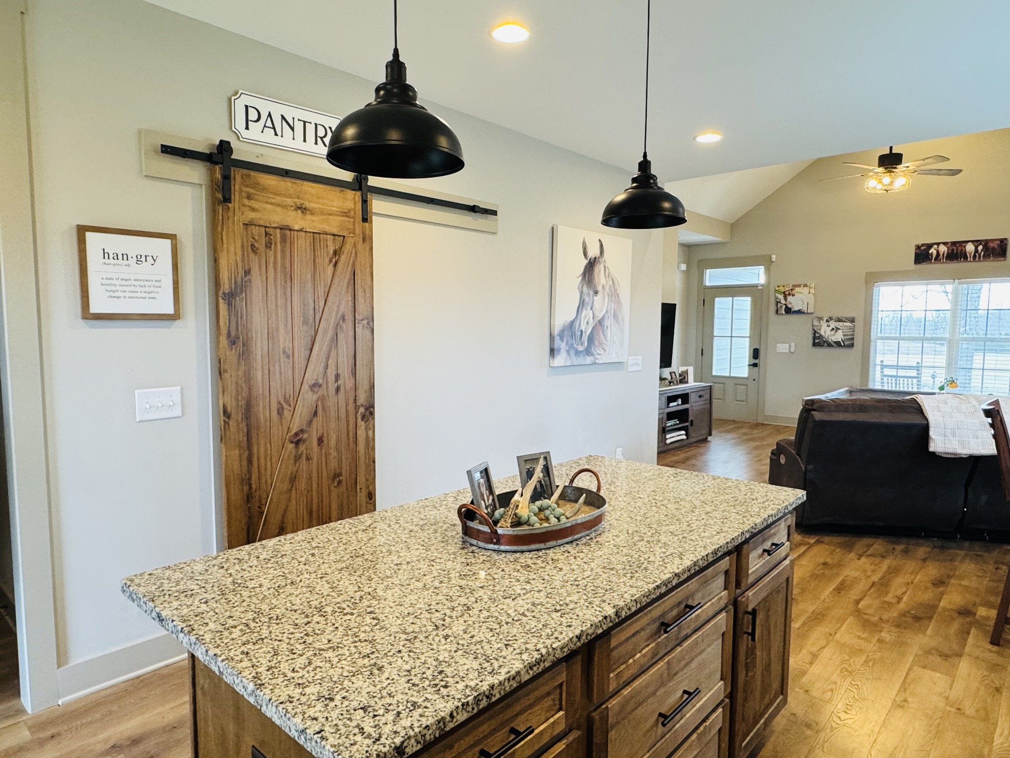 319 Lear Road Portland, TN 37148 - Photo 18 of 32 a kitchen with granite countertop a table and a refrigerator