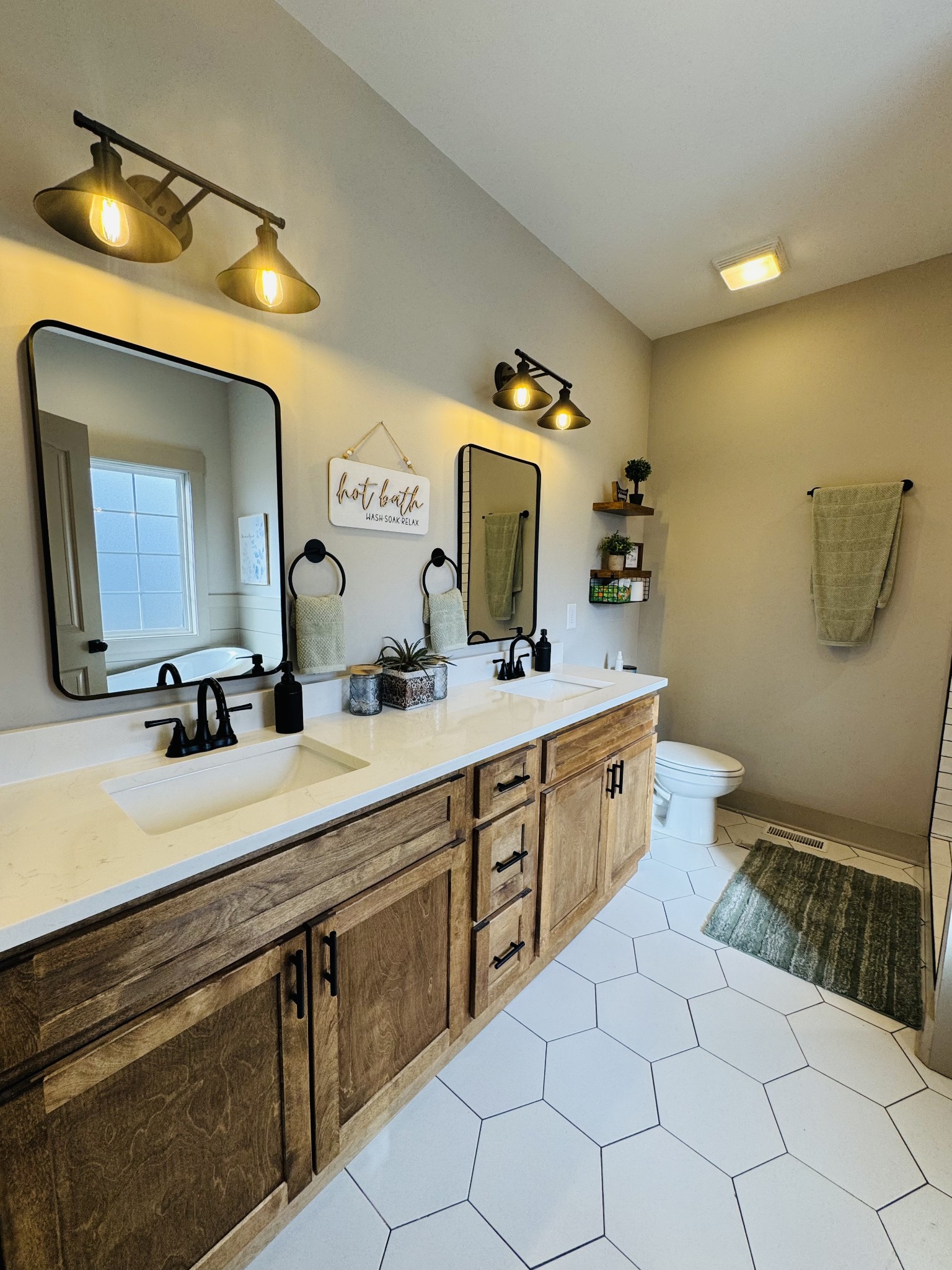 319 Lear Road Portland, TN 37148 - Photo 20 of 32 a spacious bathroom with a double vanity sink and a mirror
