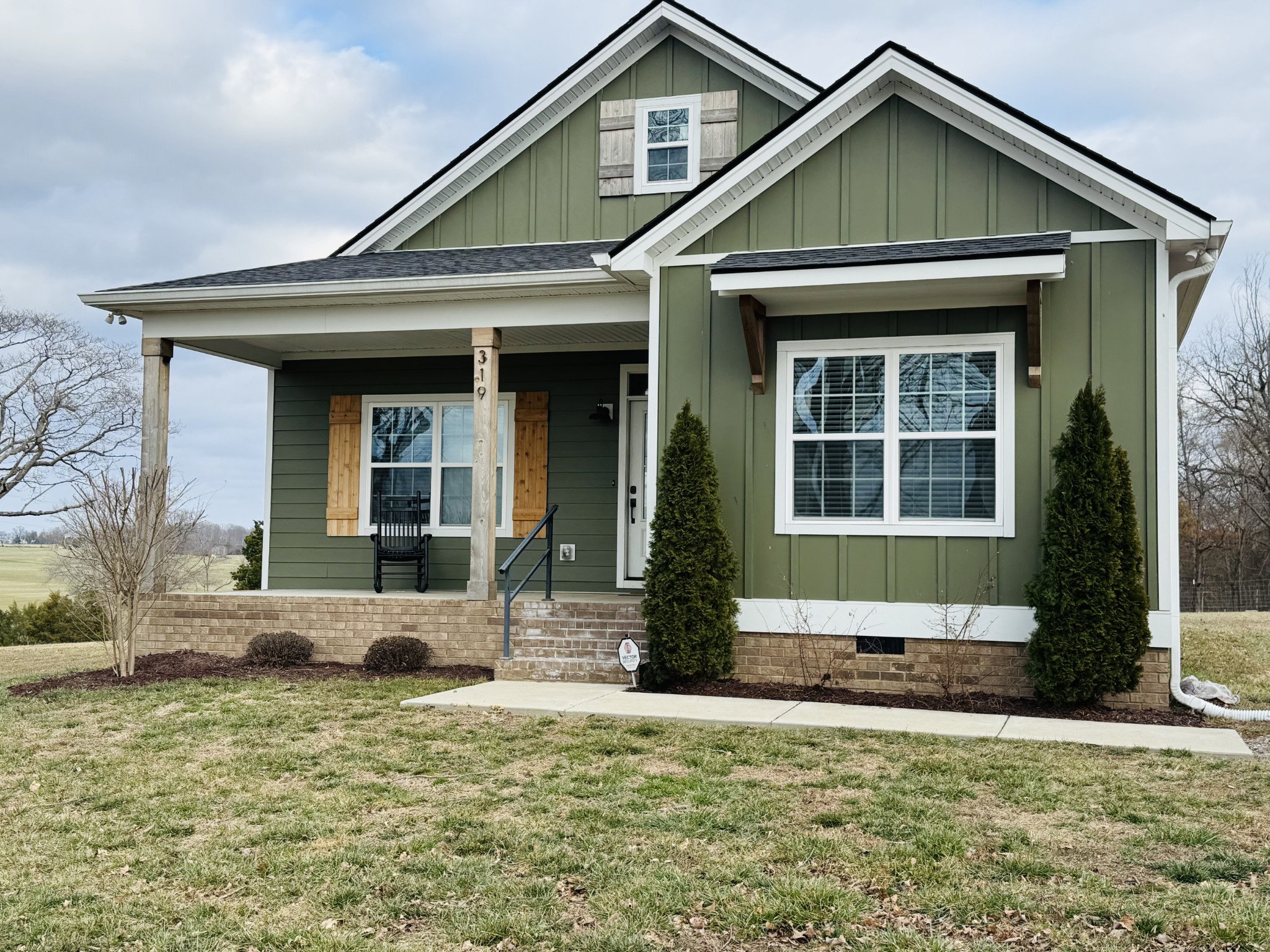 319 Lear Road Portland, TN 37148 - Photo 2 of 32 a front view of a house with garden