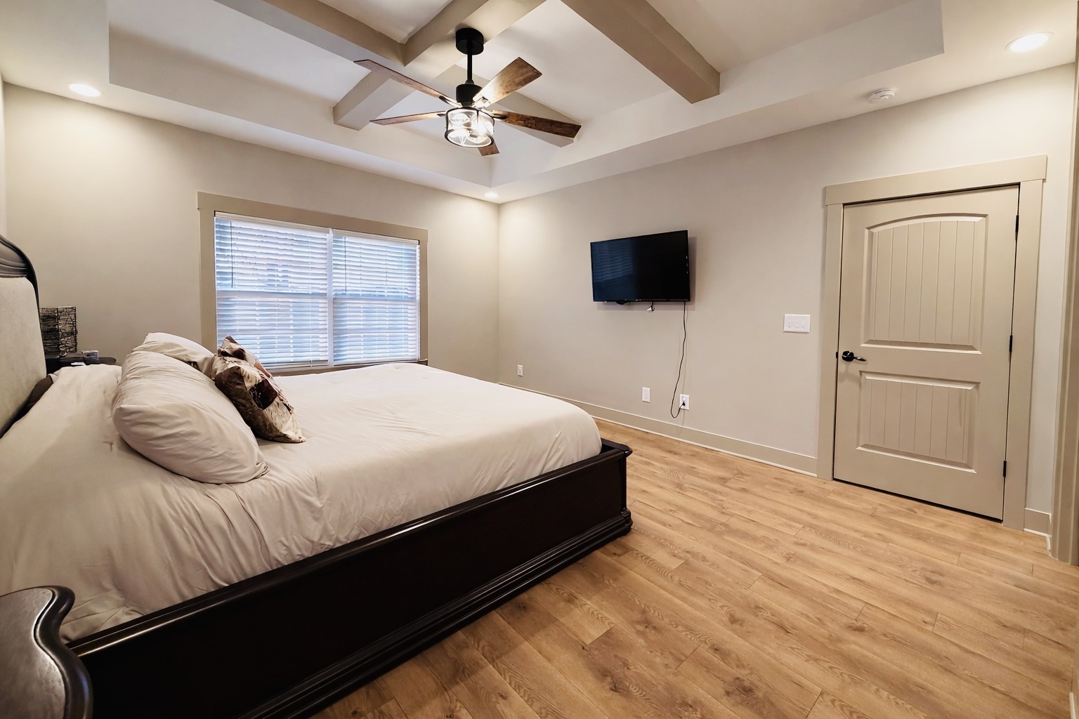 319 Lear Road Portland, TN 37148 - Photo 9 of 32 a bedroom with a large bed a flat tv screen and dresser