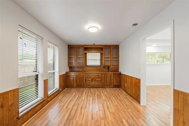 a view of a bathroom with sink and wooden floor