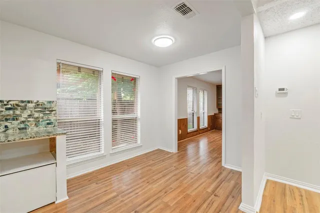 a view of a house with wooden floor and a window