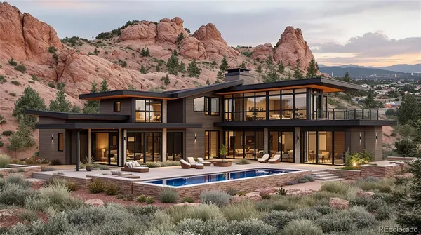 a front view of a house with swimming pool and furniture
