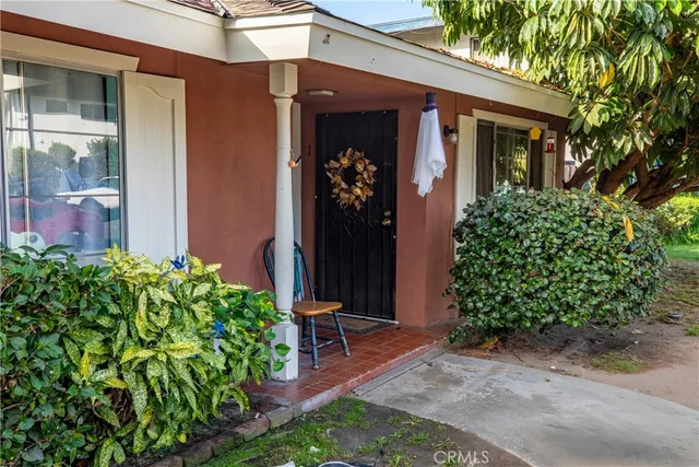 a living room with a couch and table chair