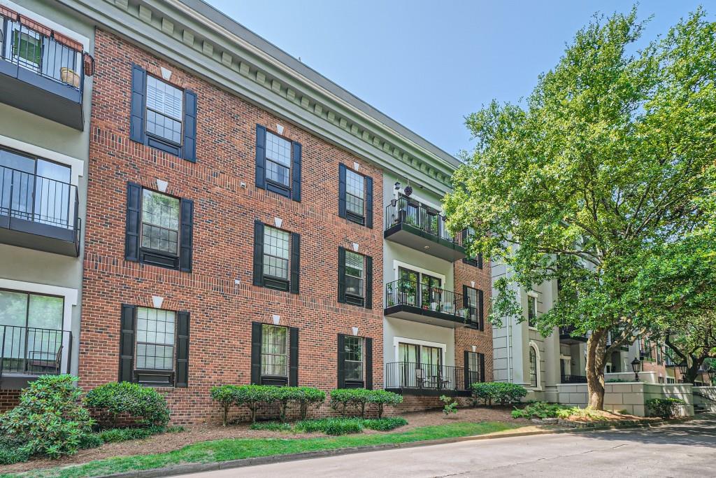 3071 Lenox Road Northeast, Unit 41 Atlanta, GA 30324 - Photo 1 of 1 a front view of a multi story building with yard