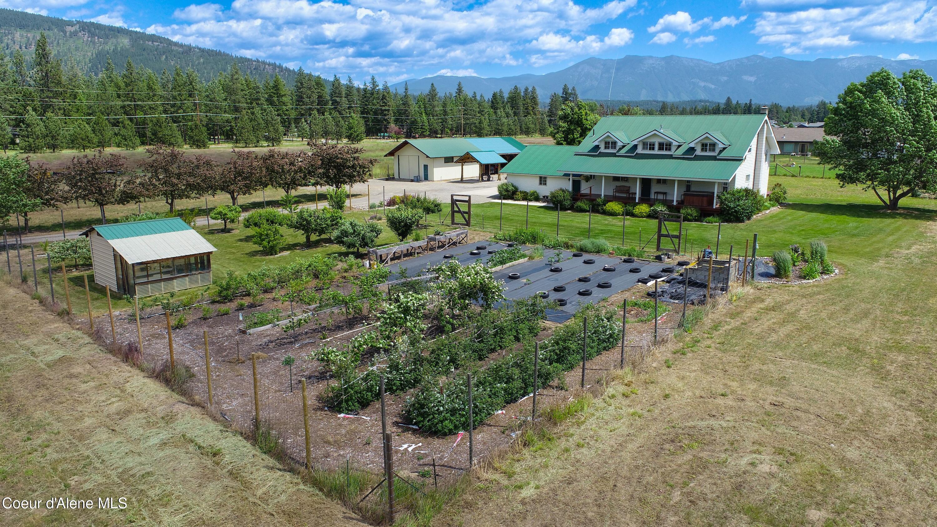 101 Zimmerman Road Moyie Springs, ID 83845 - Photo 3 of 39 Drone front ext w garden view