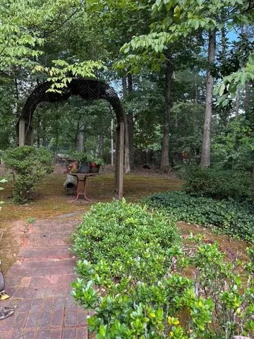 a view of a room with wooden floor and white walls
