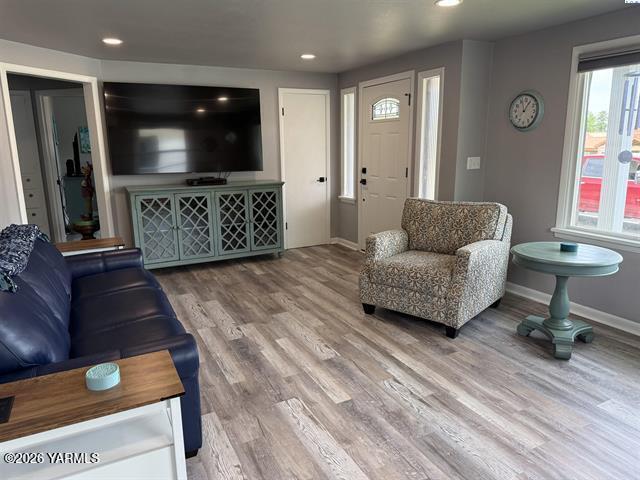 815 Ellen Avenue Prosser, WA 99350 - Photo 7 of 16 a living room with furniture and a flat screen tv