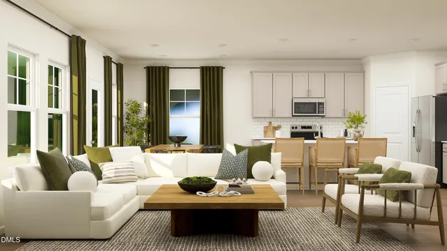 a living room with furniture fireplace and a window