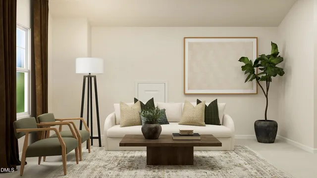 a living room with furniture and a potted plant