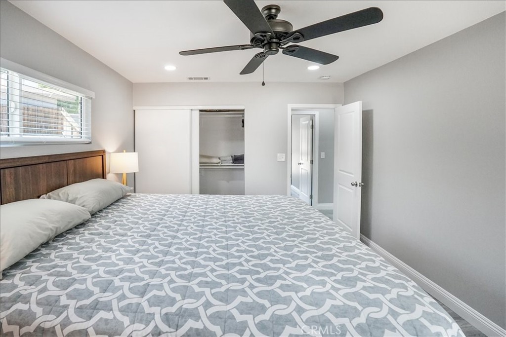 39120 Paradise Way Cathedral City, CA 92234 - Photo 18 of 41 a bedroom with a large bed and a window