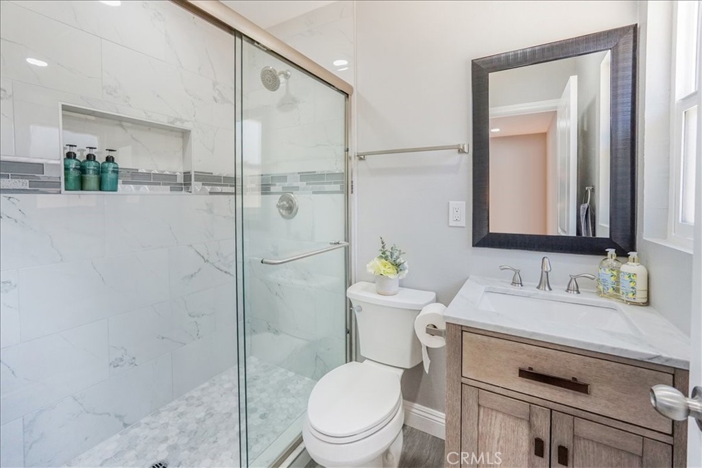 39120 Paradise Way Cathedral City, CA 92234 - Photo 19 of 41 a bathroom with a toilet sink and shower