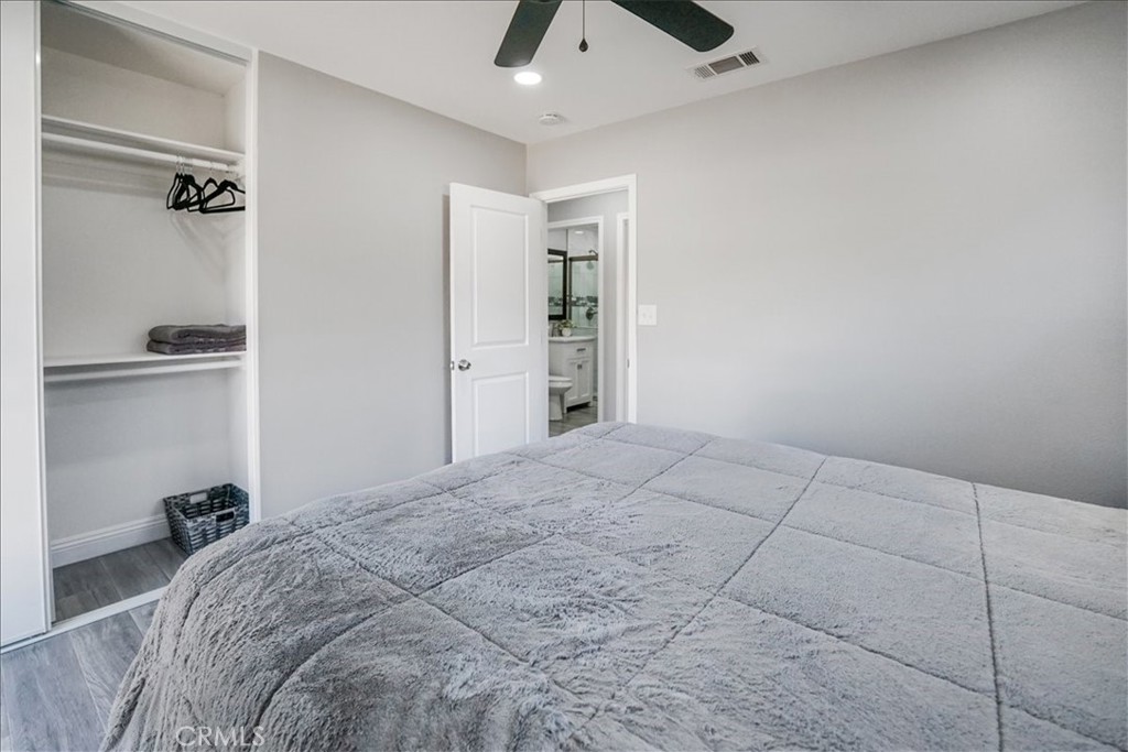 39120 Paradise Way Cathedral City, CA 92234 - Photo 22 of 41 a bedroom with a bed and a chandelier