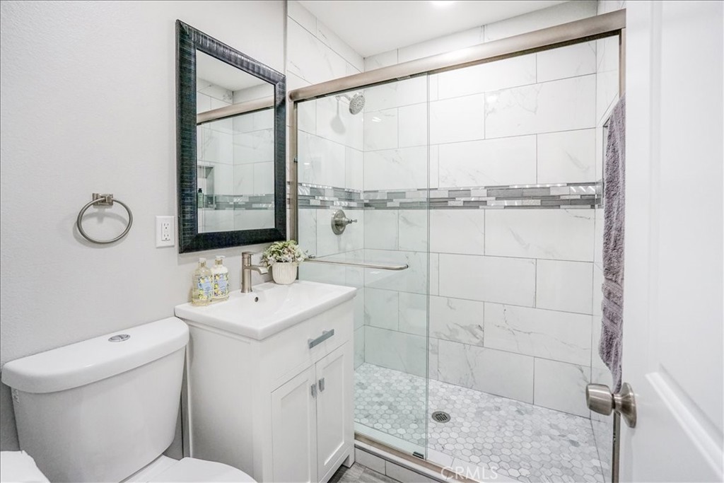 39120 Paradise Way Cathedral City, CA 92234 - Photo 23 of 41 a bathroom with a sink toilet and shower