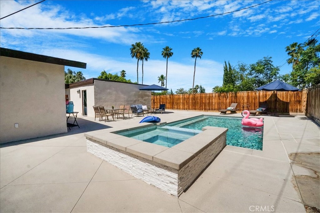 39120 Paradise Way Cathedral City, CA 92234 - Photo 28 of 41 a view of a backyard with couches and wooden fence