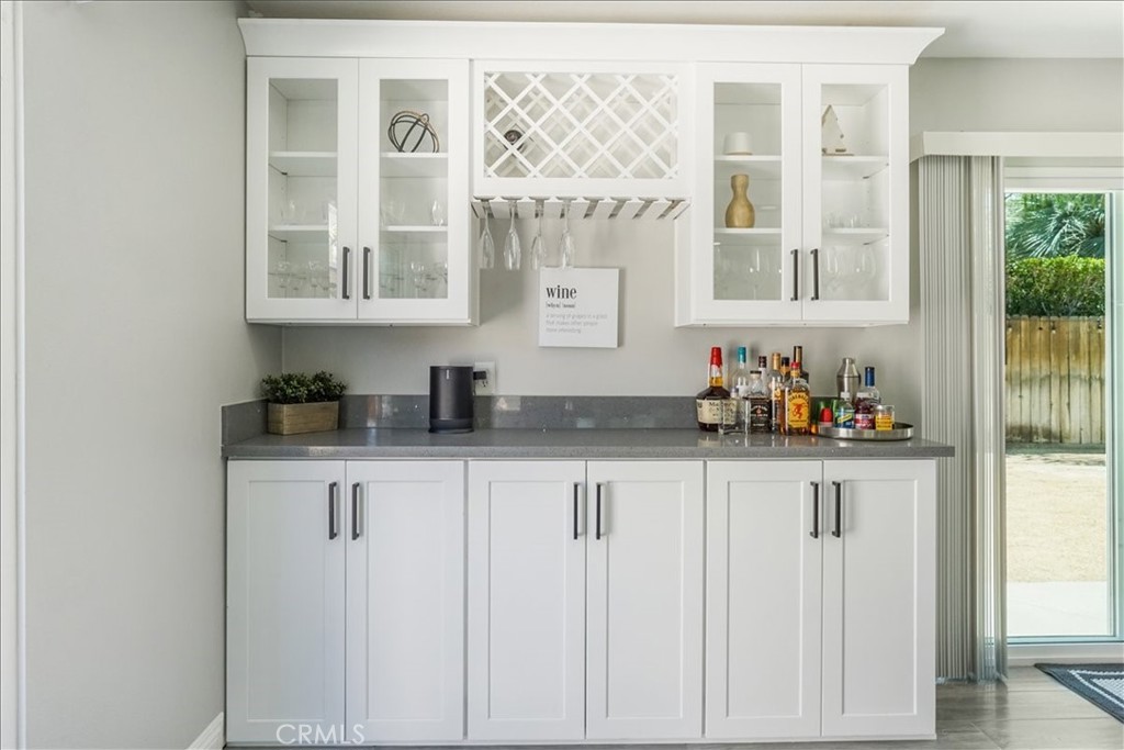 39120 Paradise Way Cathedral City, CA 92234 - Photo 8 of 41 a kitchen with stainless steel appliances granite countertop white cabinets and window