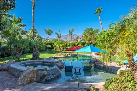 a view of a swimming pool with a patio