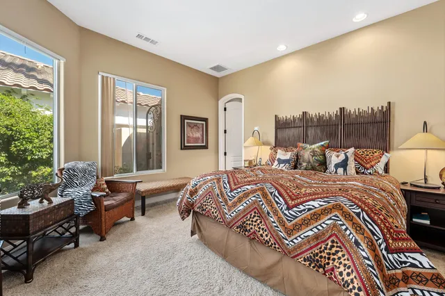 a bed room with a bed and a couch