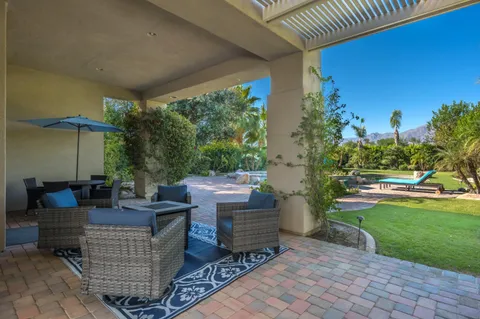 a view of an outdoor sitting area with couch and garden