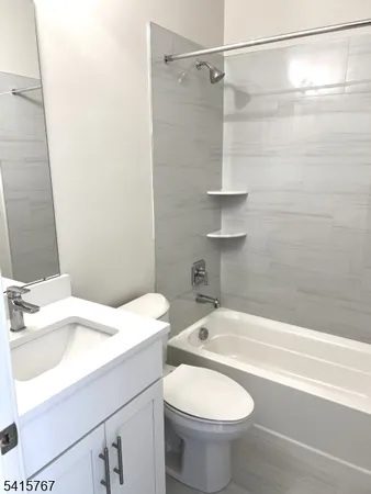a bathroom with a sink a toilet and a bathtub