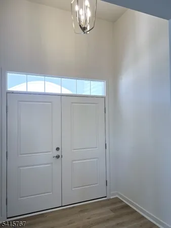 an empty room with wooden floor