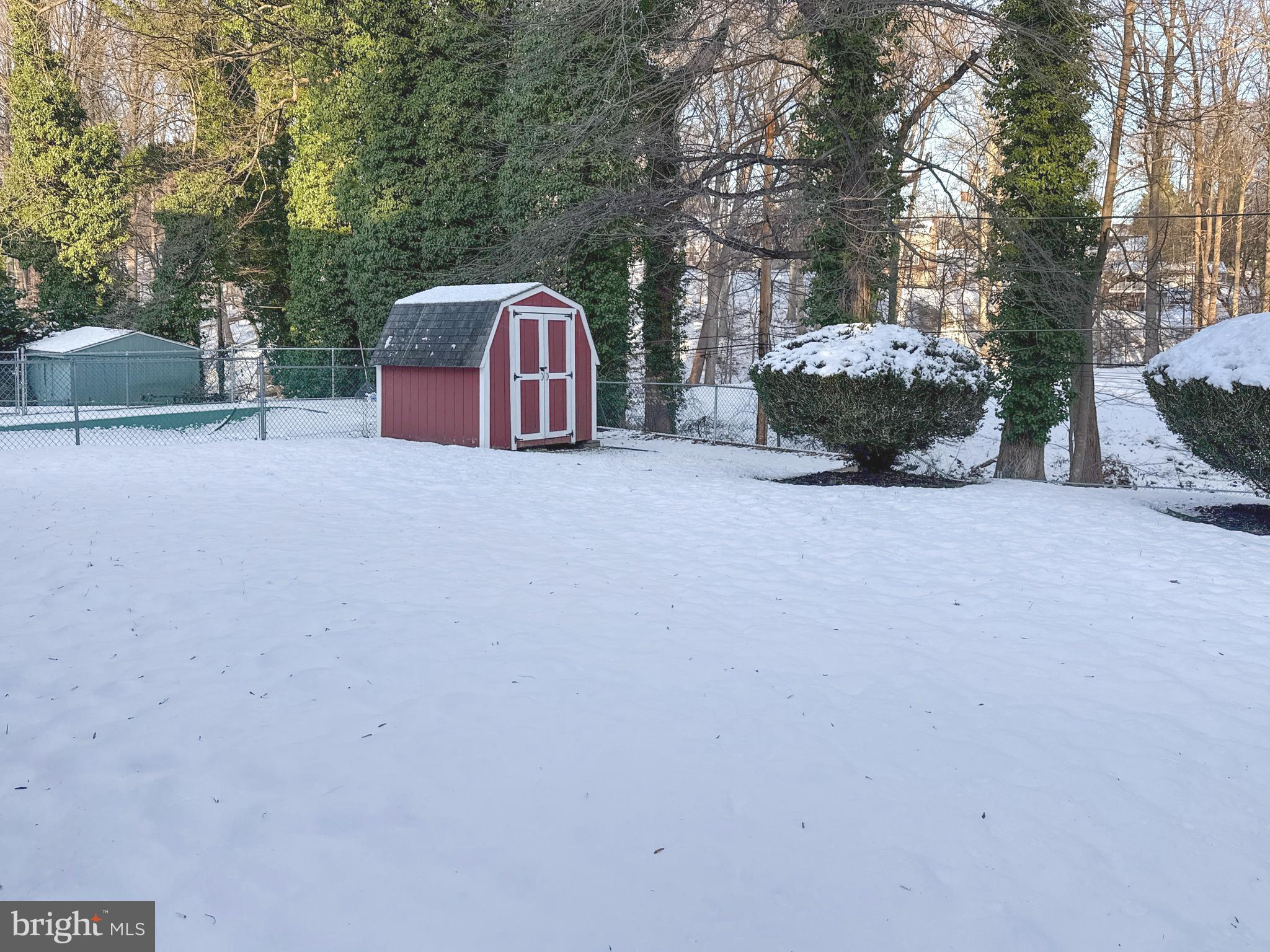 133 North Line Road Newtown Square, PA 19073 - Photo 23 of 23 a backyard of a house with fire pit and outdoor seating