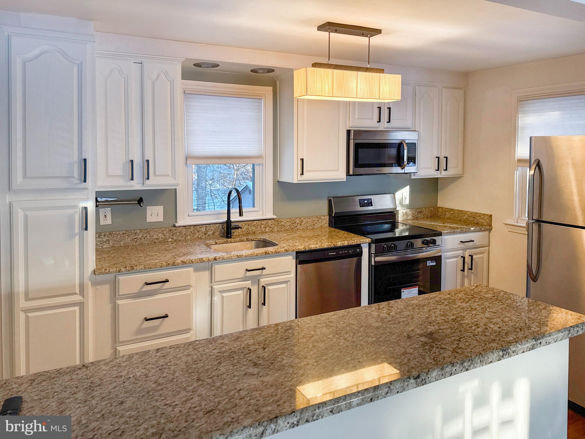 133 North Line Road Newtown Square, PA 19073 - Photo 5 of 23 a kitchen with stainless steel appliances granite countertop a sink stove and refrigerator